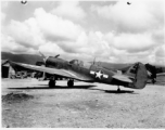 A P-40 fighter at an airstrip in Burma.  Aircraft in Burma near the 797th Engineer Forestry Company.  During WWII.