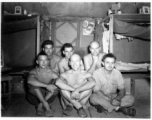 Engineers of the 797th Engineer Forestry Company pose in their barracks in Burma.  During WWII.