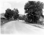 People on road in a village in Burma.  In Burma near the 797th Engineer Forestry Company.  During WWII.