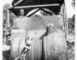 Bulldozer with cable for pulling log in Burma.  797th Engineer Forestry Company in Burma.  During WWII.