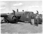 A B-25D of the 22nd Bomb Squadron 'Bombing Eagles' of the 341st Bomb Group rests down on its belly at an airfield in Kunming, China, February 3, 1944. This wrecked B-25 Mitchell should be B-25D-15, #41-30385.   Major Weatherly, the pilot, surveys the crash damage, as does and MP. At the base of the wing is a dark area: damage caused by hitting a ship’s mast during a strafing run (and causing this crash). More information about Major Weatherby and this crash can be seen here.  (Thanks for the research and in