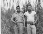 Men of 330th Troop Carrier, 9th CC, stand in a field with a carbine in the CBI during WWII.  On the left appears to be the person labeled “POP” in the bottom left of the Engine Change Crew photo, standing on the right of Arnold. POP appears in a few other photos too—he may have been an important member of the team.  From the collection of Arnold Wall. (Much appreciation to son D. W.)