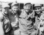 Men of 330th Troop Carrier, 9th CC.   Arnold Wall with three other buddies. No names on the back of the original picture, however, from left to right, the men are likely Arnold Wall, Dave Sobel, R. C. Werner, and Milt Sobel.  From the collection of Arnold Wall. (Much appreciation to son D. W.)