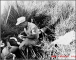 A medic attending to a victim of a bomb accidently exploding during a demonstration.