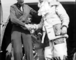 Santa Claus, in full costume, makes an air transport arrival in the CBI during WWII.