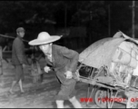 A fleeing Chinese refugee pulls possession on a cart in Guangxi province, China, during the fall of 1944, in the face of the Japanese Ichigo campaign.