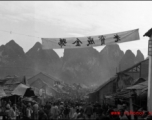 A crowded street in Liuzhou city, Guangxi province, probably just before the evacuation for Ichigo in the fall of 1944. The banner advertises a brand of product.