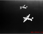 B-24 bombers in flight over water in the CBI. 