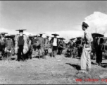 Workers in locally made hats and weather protection in China during WWII. These are most likely working on an American air base.  Official Gov. Image.