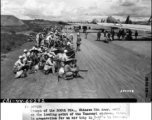 Troops of the 200th Div., Chinese 5th Army, wait at the loading point of the Yunnanyi airbase, China.