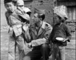 Ted Karczewski (??) with Chinese children somewhere in China.