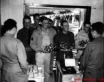 Happy servicemen receiving beer and cigarettes in the CBI.