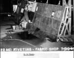 Repairing an aluminum wing, 97th Repair Squadron, fabric shop on July 30, 1944.