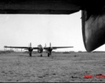 A P-61 Black Widow framed by the tail of another P-61 China. During WWII.