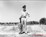 An American soldier with a handbag in the CBI.  From the collection of Wozniak, combat photographer for the 491st Bomb Squadron, in the CBI.