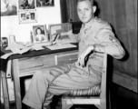 An American serviceman in the CBI writing at his desk in the barracks.  From the collection of Wozniak, combat photographer for the 491st Bomb Squadron, in the CBI.