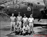 Officers of the 22nd Bombardment Squadron stand before one of the squadron's B-25D's at Chakulia Air Base, India.