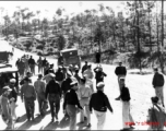 American GIs at Yangkai base in Yunnan province in the CBI walk on the road. During WWII.