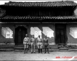 Chinese soldiers in the CBI stand before building with a slogan 整军经武 (roughly "build up the military")  in Yunnan province, China.