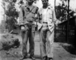 Thomas Clougherty, Fred Campangna pose on a pathway at an American base in the CBI, likely in Yunnan.