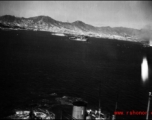 An American bombing raid on Japanese shipping, running just feet above a Japanese ship. Notice the white-suited sailors, probably Japanese or Korean, in action on the ship.