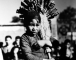 Local people in China, including a young candied fruit seller selling candied haws fruit on bamboo skewers.  From the collection of Eugene T. Wozniak.