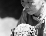 Local people in China: An elderly woman and infant. During WWII.