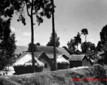 A local village in China during WWII, the houses with thatched roofs.