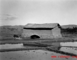 A mill house or similar in the countryside in Yunnan province, China, during WWII.  From the collection of Eugene T. Wozniak.