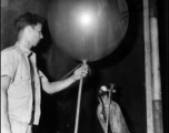 A balloon being filled with helium or hydrogen, probably as part of some kind meteorological measurement, during WWII in the CBI.