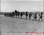 10 AF 10DEC44 G165-10 Chinese Troops march to plane in Burma during WWII. 