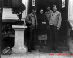 An elite Chinese woman poses with American servicemen and local people in Yunnan province, China, during WWII. 