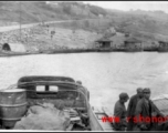 On a ferry with Chinese soldiers crossing a river in southwest China during WWII.