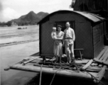 A western family on a barge in a river in Guangxi province, probably near Liuzhou city or Guilin city.  Selig Seidler was a member of the 16th Combat Camera Unit in the CBI during WWII.