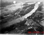 Aerial view of bombed bridge in SW China or French Indochina during WWII.