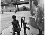 A public water well in front of Calcutta's New Market (Hogg's Market), during WWII.  Photo from Mary Bernald.