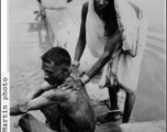 A domestic riverside bath in India during WWII.  Photo from John C. Martin.