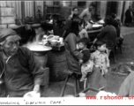 Sidewalk eatery in Chongqing during WWII. In the CBI.