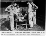 Y-Force Liaison Team prepares a pig for dinner at the 4th of July celebration, 1944, near Pingka Ridge, Burma, during the Salween River Campaign.  Photo by Syd Greenberg.