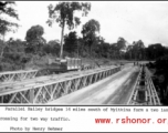 Parallel Bailey bridges 14 miles south of Myitkina form a two lane crossing for two way military traffic.   Photo from Henry Behmer.