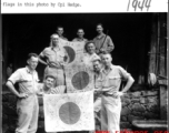 Y Force liaison team shows of captured Japanese Good-Luck Flags  (寄せ書き日の丸) collected on the battleground in the CBI during WWII. 1944.  Photo by Cpl. Hedge.