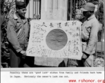 An American and a Chinese soldier show a  captured Japanese Good-Luck Flag  (寄せ書き日の丸) collected on the battleground in the CBI during WWII.  US Army Signal Corps Photo.