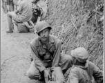 Medic, Captain Borak, on the Burma Road, tends to a Chinese soldier's wounds during the Salween River Campaign, 1944.  Photo by T/Sgt. Syd Greenberg.