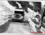 Trucks travel through mountain snow in the CBI during WWII.