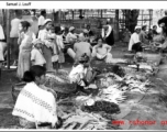 A farmer's market in SW China or Burma during WWII.  Photo from Samuel J. Louff.