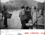 Public wash stand in Kunming, Yunnan province, China, during WWII.  Photo by A. H. Kitzerow, provided by Wilkinson.