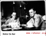 Two GIs have an elegant dinner in the CBI during WWII.  Walter De Blair.