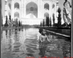 A kid playing in reflecting pool at Taj Mahal during WWII.