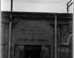 T/Sgt. George M. Zdanoff standing at HQ at Hastings Mills, India, during WWII.