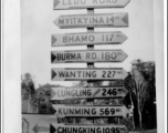 Heavily loaded sign post along Ledo Road, Burma, 1945.